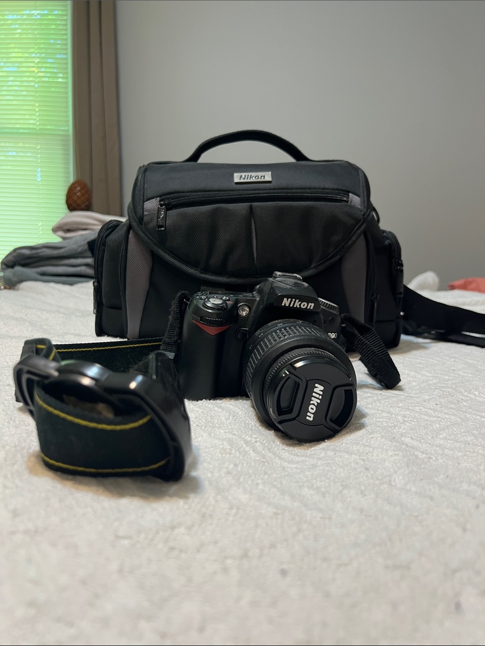 Nikon D90 DSLR with Lens, Black Carry Bag and Strap